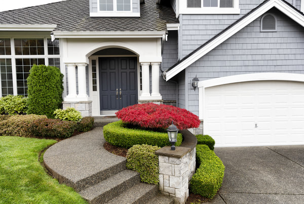 We installed exposed aggregate concrete stairs that matched the driveway of this Burnaby home. The colour that was requested was on the darker side.